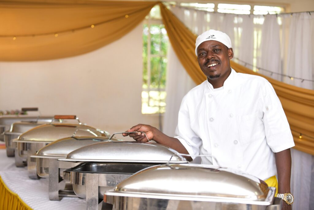 Man showing bain marie in hotel restaurant