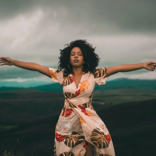 Stock image of woman on the mountain top